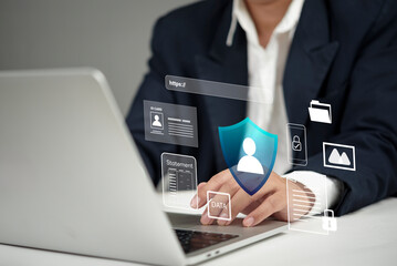 Data protection and privacy on the internet. businessman uses laptop with shield cybersecurity....