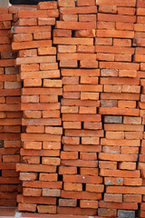  Tall rectangular construction brick pile stacked tightly in large vertical shape
