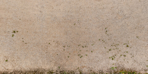 top view of gravel road surface with tractor tire tracks in countryside