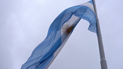 Argentinian flag waving in the wind against the sky - Powered by Adobe