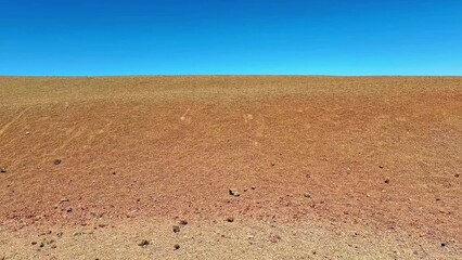 Take a moment to explore the stunning expanse of the arid and beautiful desert landscape on a clear day