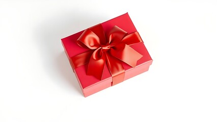 Obraz premium Luxurious red gift box tied with a satin ribbon, elegantly presented on a clean white surface.