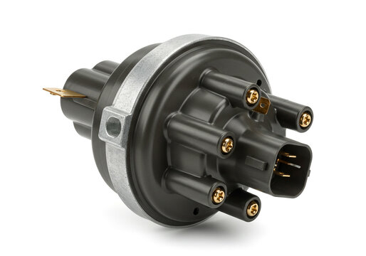 Close up shot of a black car distributor with gold screws on a white background studio shot