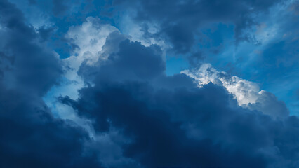 Dark and Moody Clouds with a Glimpse of Blue Sky