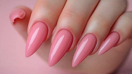 Close-up of manicured, pointed, pink nails
