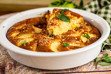 Lush apple dessert in the oven aroma of cinnamon and vanilla