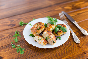 Chicken cutlets with a crispy crust on a wooden table