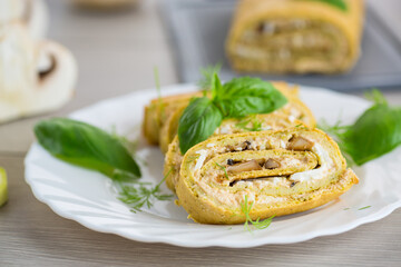 Zucchini roll with baked mushrooms and cheese