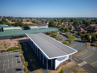 Contemporary industrial business park with commercial warehouses, logistics distribution hub, storage units, trading estate buildings and modern office facilities in a large industrial complex