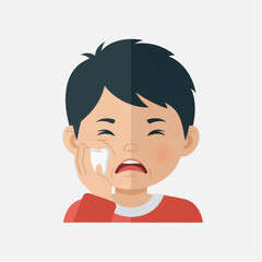 Young boy with a sad expression wiping tears from his face while wearing a red shirt indoors