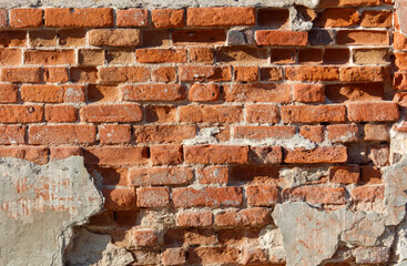 A brick wall with a hole in it