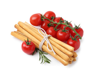 Delicious grissini sticks with fresh tomatoes and rosemary isolated on white