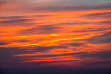 A breathtaking sunset paints the sky above Pinglin, New Taipei City, Taiwan, with vibrant streaks of orange and red, creating a stunning natural backdrop.