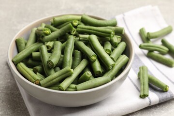 Many raw green beans on grey table, closeup