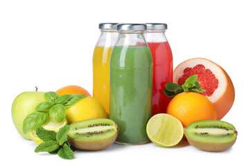 Tasty juices in glass bottles, fresh fruits, mint and basil isolated on white