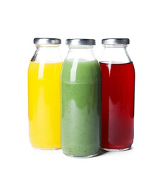 Tasty juices in glass bottles isolated on white