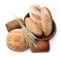 Different types of bread and wheat spikes isolated on white, top view