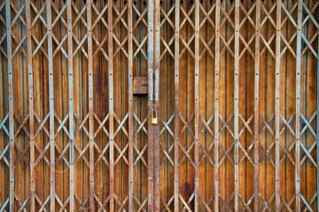 2. Vintage and rusty expandable steel gate with classic folding design