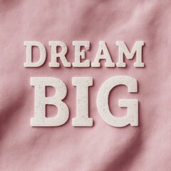 Dream Big in white letters on a pink background