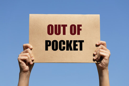 Out of pocket text on paper holding by a woman's hand with blue sky background
