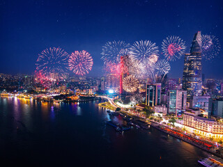 Aerial view Ho Chi Minh City with fireworks light, celebration of Vietnam. Skyscraper landmark of Saigon, concept New Year and Tet holiday © Parilov