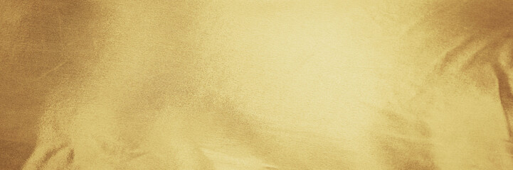 Gold golden orange yellow champagne white abstract background. Shiny silk fabric. Metallic shine. Light reflection. Design. Festive Christmas invitation wedding fashion beauty Birthday. Wide banner.