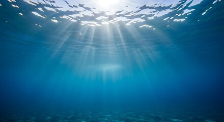 Fototapeta premium Sunbeams Penetrating Deep Blue Ocean Water Creating Mesmerizing Underwater Light Rays