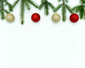 New Year's white Background with Christmas Tree Branches and Christmas Balls, New Year Toys, space for text, a place for a picture