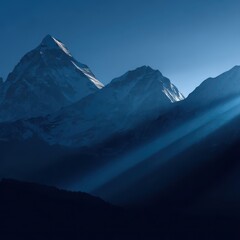Fototapeta premium Majestic mountain peaks bathed in the dawn light.