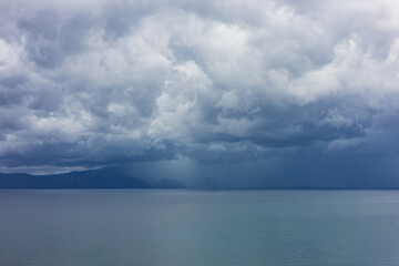 Thunderclouds over the sea or downpour in the sea. Adriatic Sea, Croatia.