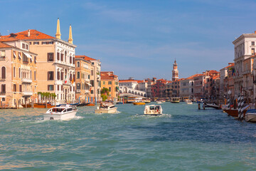 Obraz premium Traditional Venetian canal house with balconies and moored boat on Grand Canal in Venice Italy