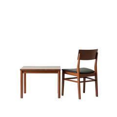 Wooden table and chair set against a dark background.