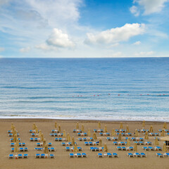 Empty Beach with Sunbeds and Umbrellas.