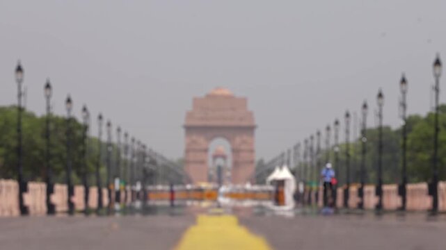 Bokeh view of Kartavya Path in front of India Gate during the heatwave season in New Delhi, India. Blurred background footage.