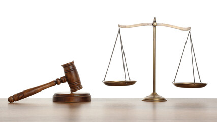 Golden scales of justice and gavel on wooden table against white background