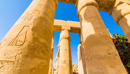 Carved stone pillars with ancient hieroglyphs.