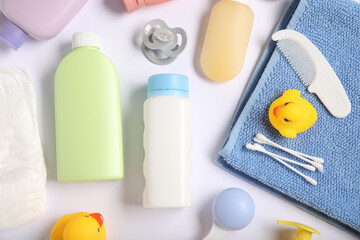 Baby accessories and cosmetic products on white background, flat lay