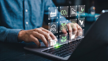 Eco-conscious professional analyzes environmental data with laptop, promoting sustainability initiatives