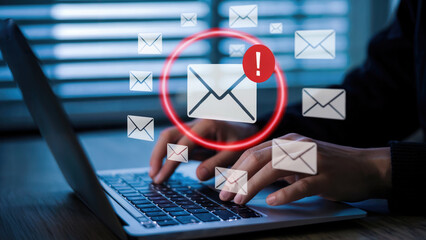 Urgent email alert: Cybersecurity threat detected on laptop with warning icon, digital risk