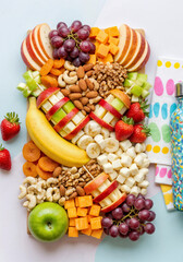 Healthy fruit and nut snack board assorted fresh fruit cheese nuts school lunch