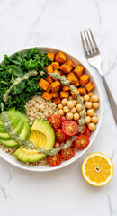 Classic vegan buddha bowl with avocado kale chickpeas sweet potato brown rice and lemon
