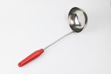 Stainless steel ladle with red handle for cooking