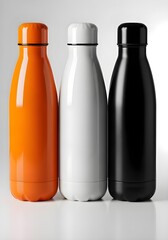 Three sleek insulated water bottles in orange, white, and black stand ready for modern hydration needs, perfect for active lifestyles.