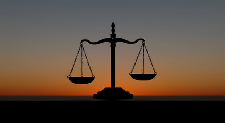 Silhouette of a balance scale at sunset, symbolizing justice and fairness.