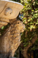 Close up of a carved stone lion head detail from Morosini Fountain in Heraklion, Crete, Greece
