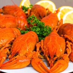 Cooked crayfish on a plate with lemon slices