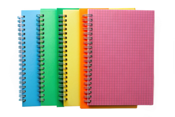 Colorful spiral bound notebooks lined up against a black background