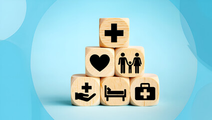 Wooden cubes with health symbols stacked on blue background care medical