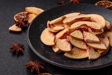 Fototapeta premium Dried sublimated slices of peach or apricot as an ingredient for sweet desserts. Dried peach