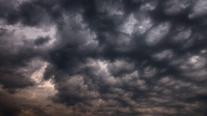 dramatic textured sky with dark cirrocumulus clouds. artistic photo of natural moody cloudscape for background or decoration